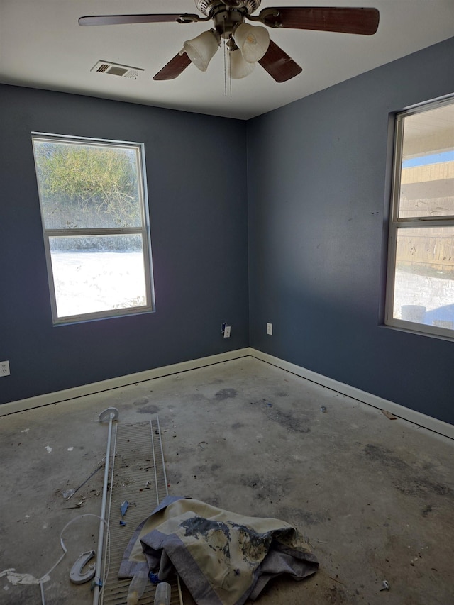 spare room with concrete flooring and ceiling fan