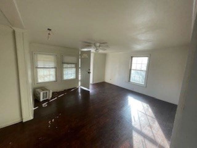 empty room featuring dark wood-type flooring