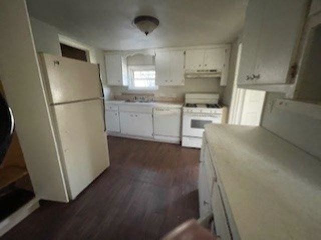 kitchen featuring sink, white appliances, dark hardwood / wood-style floors, and white cabinets