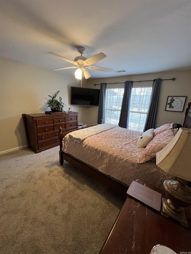 bedroom featuring ceiling fan and carpet flooring