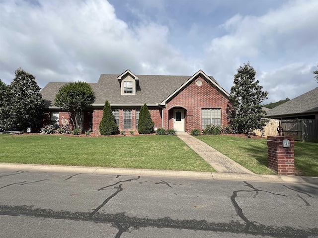 3 N Starlite Dr, Mayflower, AR 72106 - view of front of house with roof with shingles, a front yard, and brick siding