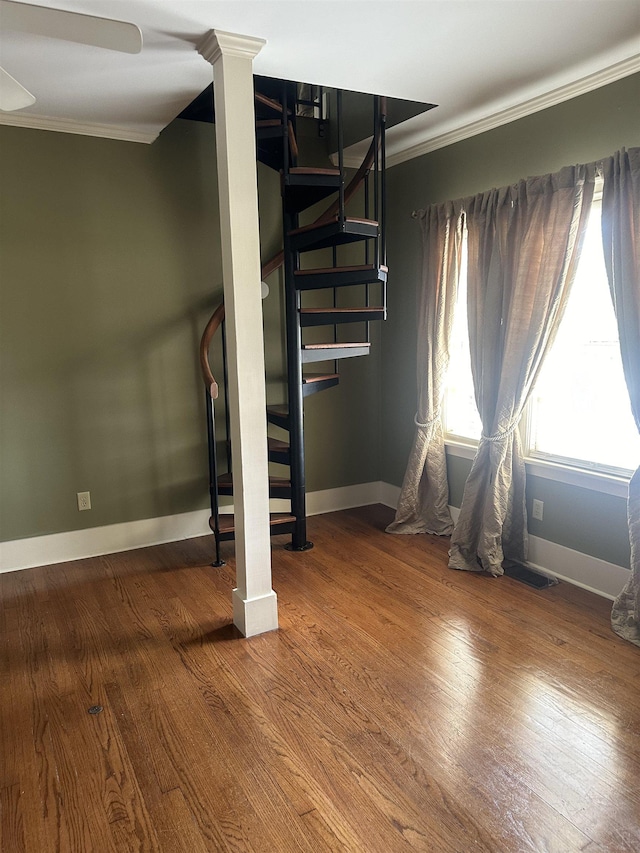 interior space with crown molding, ceiling fan, and hardwood / wood-style floors