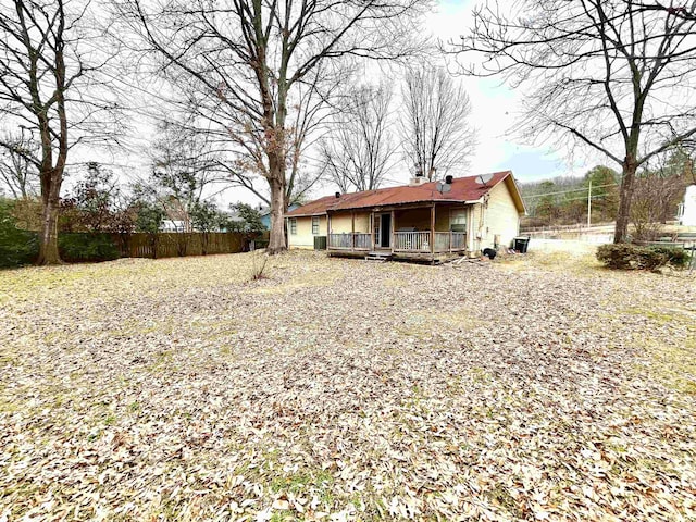 back of house featuring a wooden deck