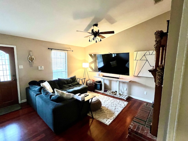 living room featuring lofted ceiling, dark hardwood / wood-style floors, and ceiling fan