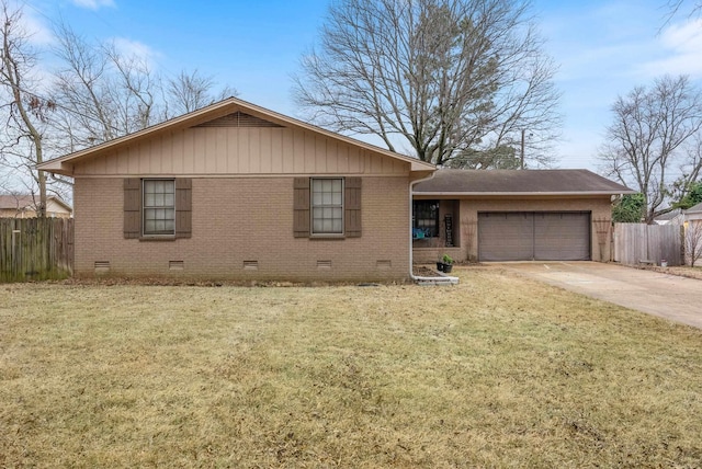 view of front of property with a garage and a front yard