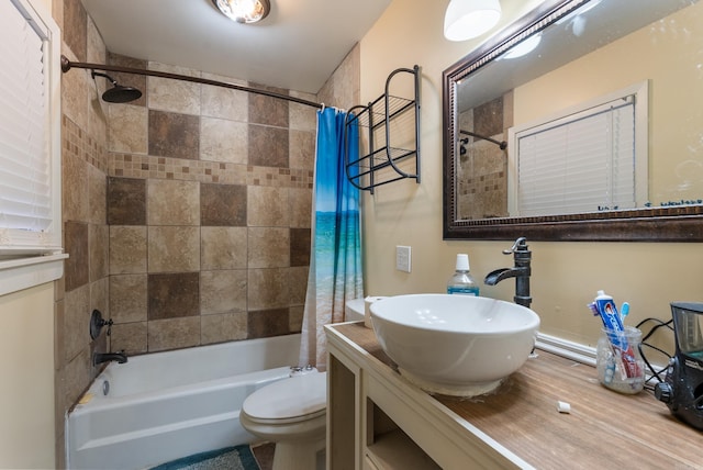 full bathroom featuring vanity, shower / tub combo, and toilet