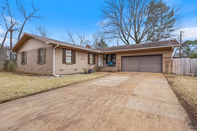 ranch-style home with a garage and a front yard