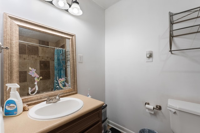 bathroom with vanity, toilet, and a shower with shower curtain