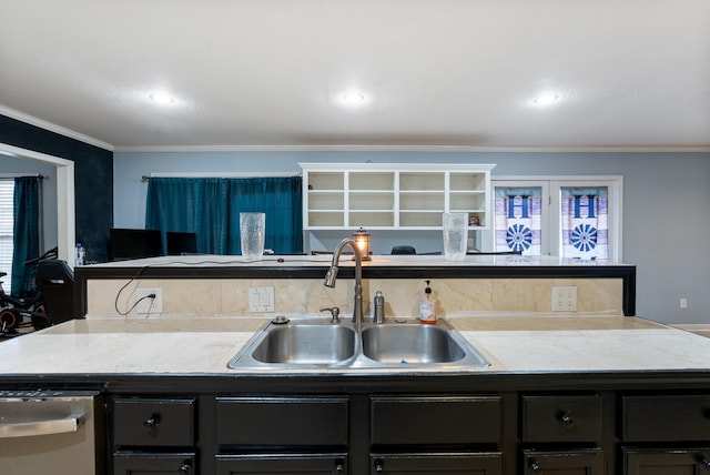 kitchen with sink, crown molding, and stainless steel dishwasher