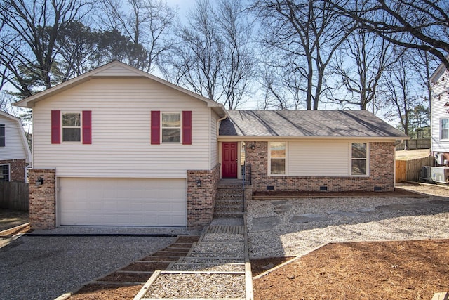 split level home featuring a garage