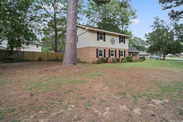 colonial home with a front lawn