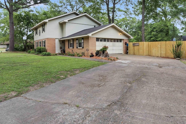 view of property with a garage and a front yard