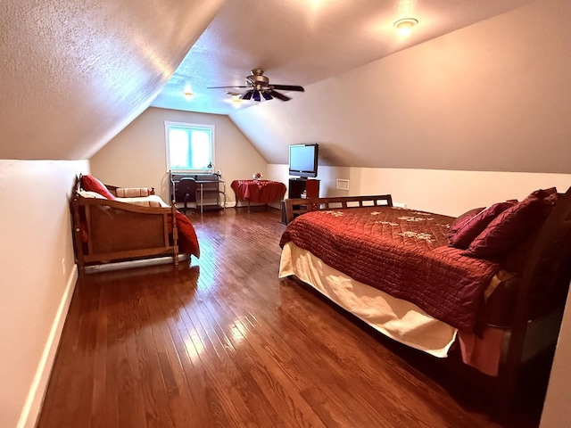 bedroom featuring hardwood / wood-style flooring, vaulted ceiling, a textured ceiling, and ceiling fan