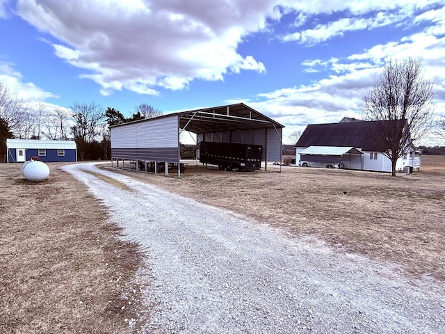 view of outbuilding featuring a carport