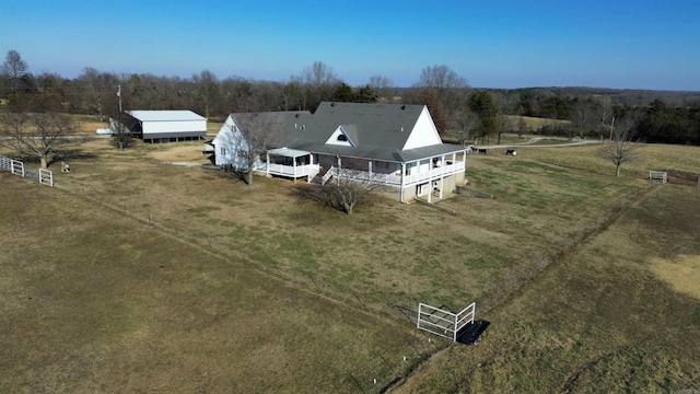 birds eye view of property featuring a rural view