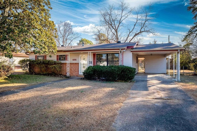 ranch-style house with a carport