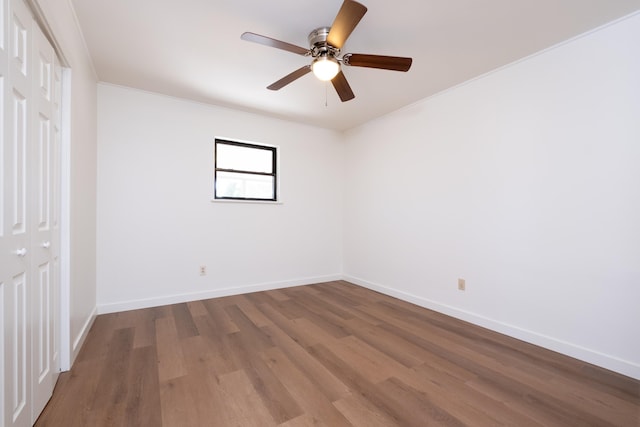 spare room featuring hardwood / wood-style flooring and ceiling fan