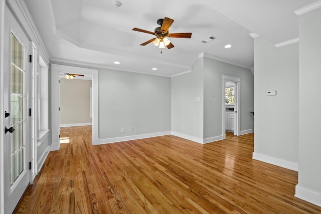 unfurnished room featuring ornamental molding, ceiling fan, and light wood-type flooring