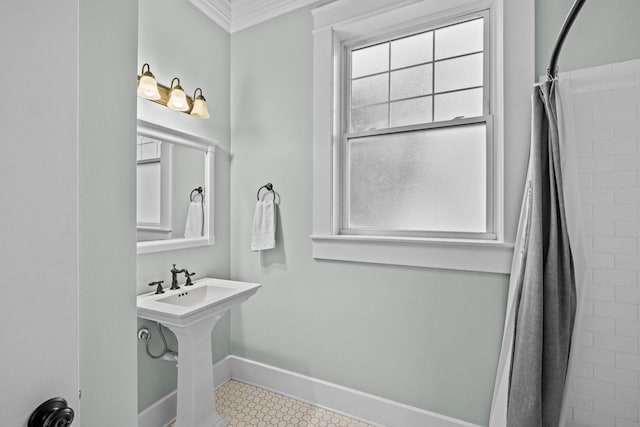 bathroom featuring ornamental molding, tile patterned floors, and walk in shower