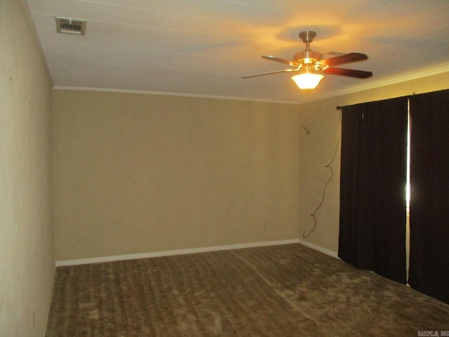 unfurnished bedroom featuring carpet flooring, a ceiling fan, baseboards, and ornamental molding