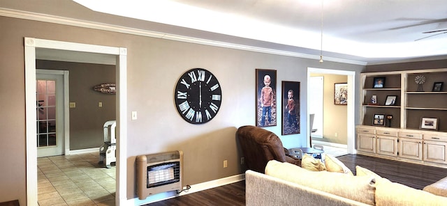 living room featuring crown molding, dark wood-type flooring, and heating unit