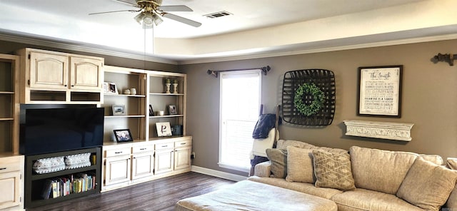 living room featuring ceiling fan, ornamental molding, and dark hardwood / wood-style flooring