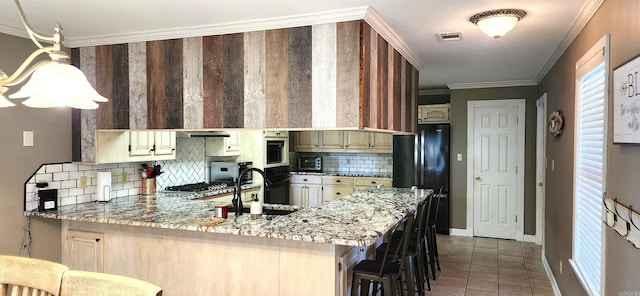 kitchen featuring ornamental molding, sink, decorative backsplash, and kitchen peninsula