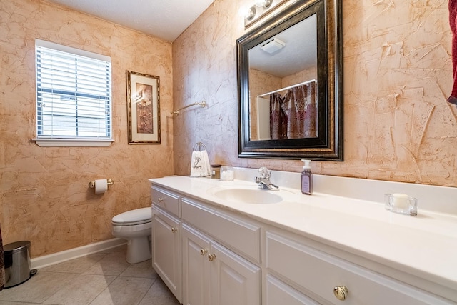 bathroom with vanity, tile patterned floors, a textured ceiling, and toilet