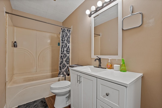 full bathroom featuring hardwood / wood-style floors, shower / bath combination with curtain, vanity, toilet, and a textured ceiling