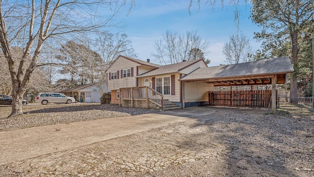 tri-level home featuring a carport