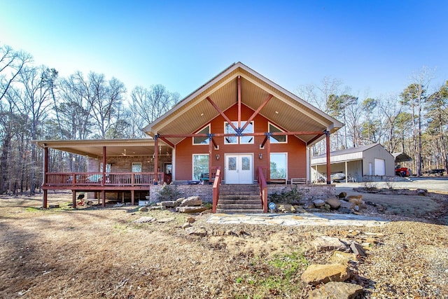 view of front of home with a garage and an outdoor structure