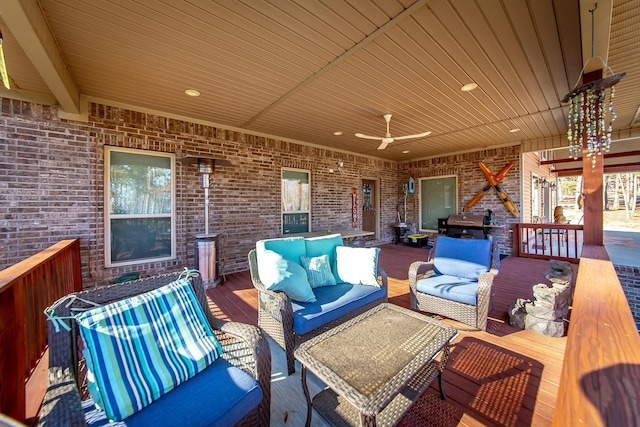 view of patio / terrace featuring grilling area, outdoor lounge area, ceiling fan, and a deck