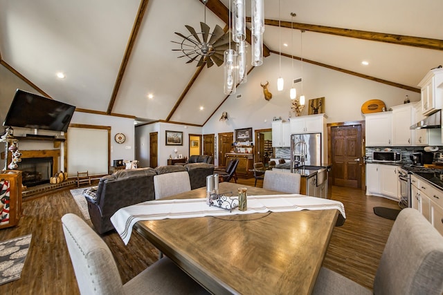 dining room featuring beam ceiling, dark wood-type flooring, and high vaulted ceiling