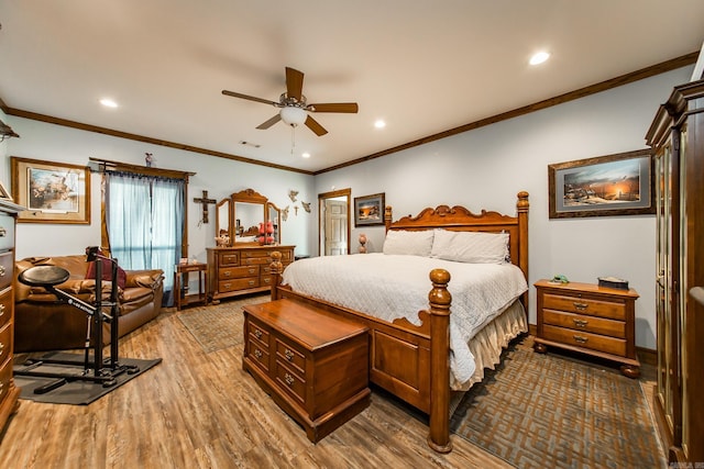 bedroom with dark hardwood / wood-style flooring, crown molding, and ceiling fan