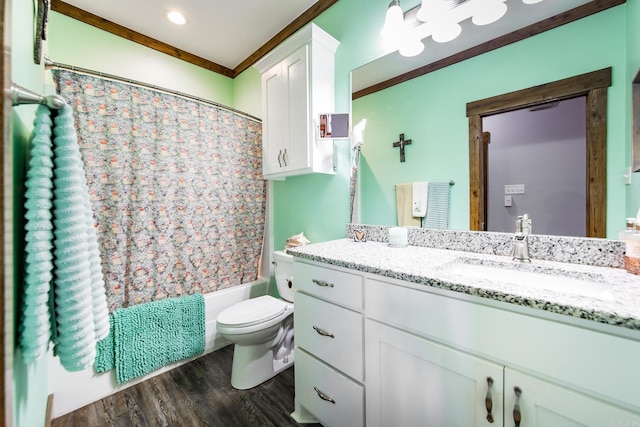 full bathroom with toilet, crown molding, wood-type flooring, shower / tub combo, and vanity