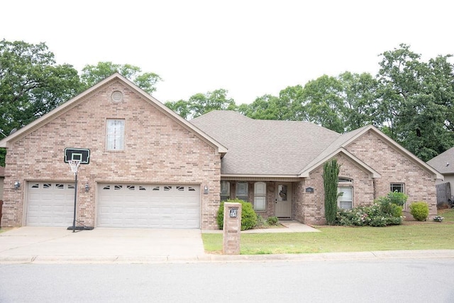 view of front of home with a garage and a front yard