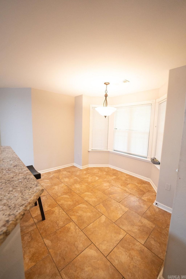 view of tiled spare room