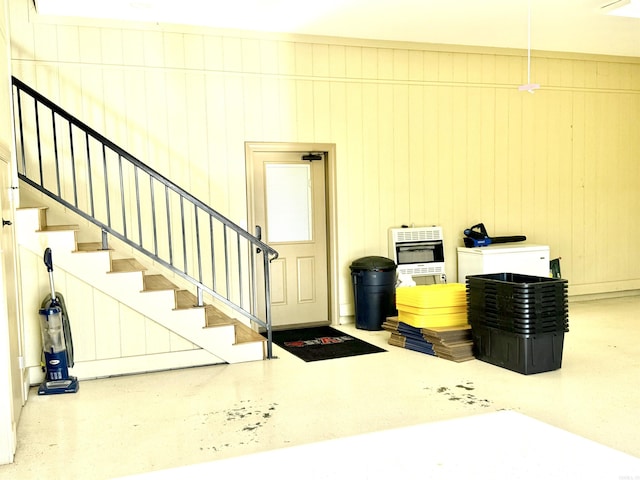 interior space featuring wooden walls and heating unit