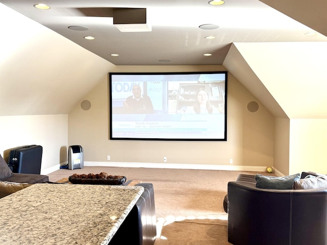 cinema featuring vaulted ceiling and carpet flooring