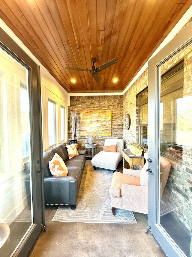 sunroom / solarium with ceiling fan and wood ceiling