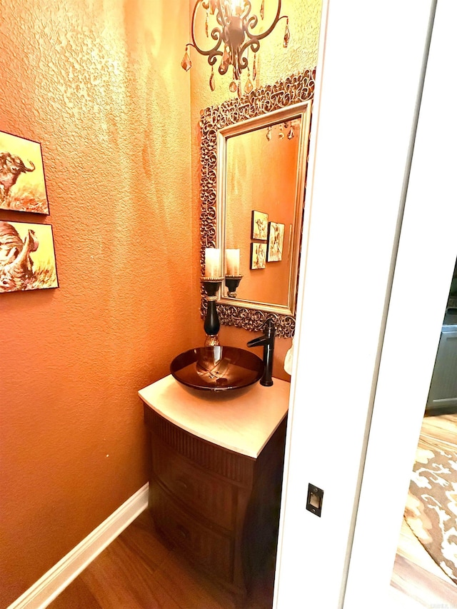 bathroom with vanity and hardwood / wood-style flooring