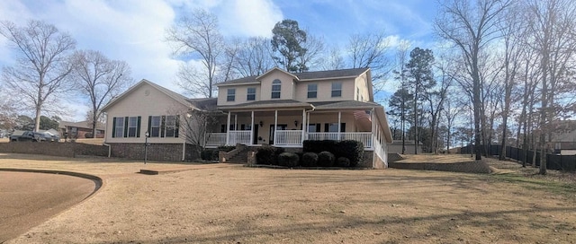 view of front property featuring a front yard and a porch