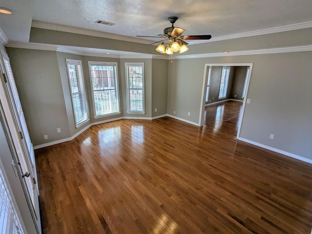 unfurnished room featuring crown molding, ceiling fan, dark hardwood / wood-style flooring, and a textured ceiling