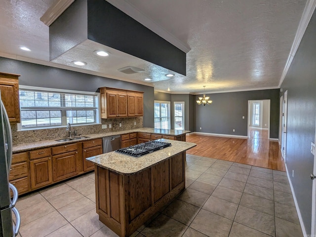 kitchen featuring ornamental molding, appliances with stainless steel finishes, sink, and light tile patterned floors