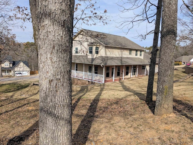 view of front of house featuring a front lawn and a porch