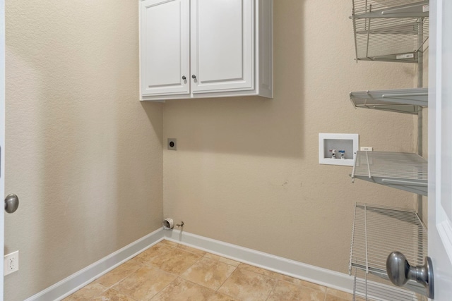 clothes washing area with cabinets, washer hookup, hookup for an electric dryer, and light tile patterned floors