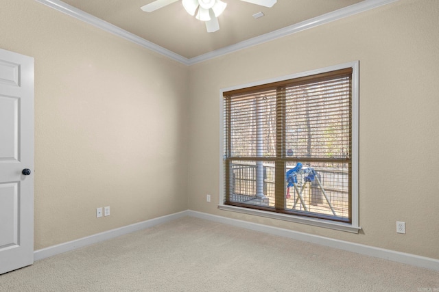 unfurnished room featuring ornamental molding, a healthy amount of sunlight, and light colored carpet