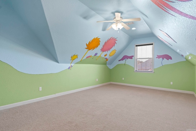 bonus room featuring lofted ceiling, a textured ceiling, and carpet flooring