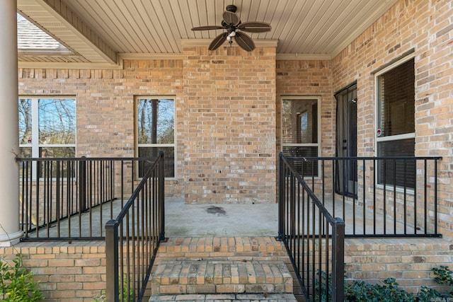 doorway to property featuring ceiling fan