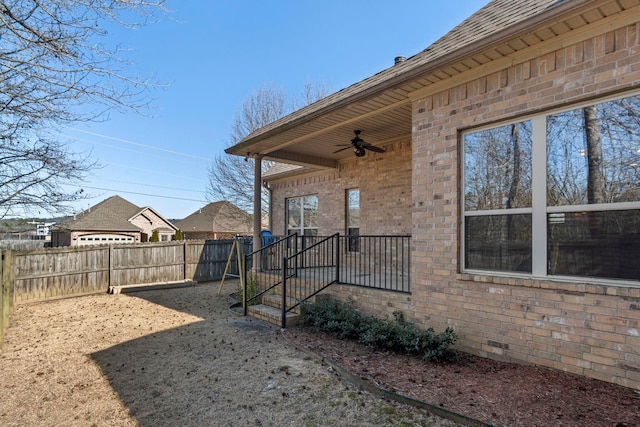 exterior space with ceiling fan